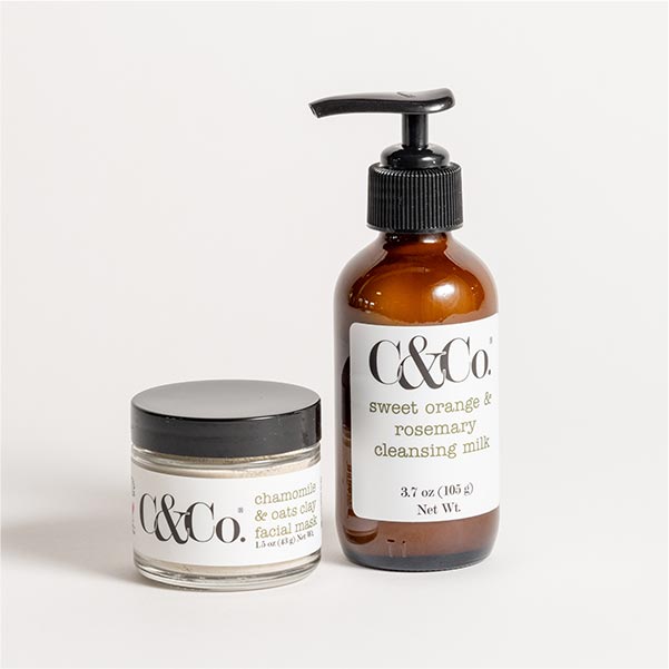 A bottle and jar of C&Co beauty products.