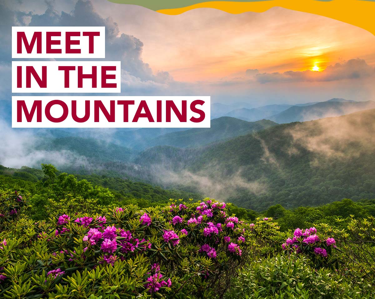 A scenic mountain view. A headline reads: Meet In The Mountains.