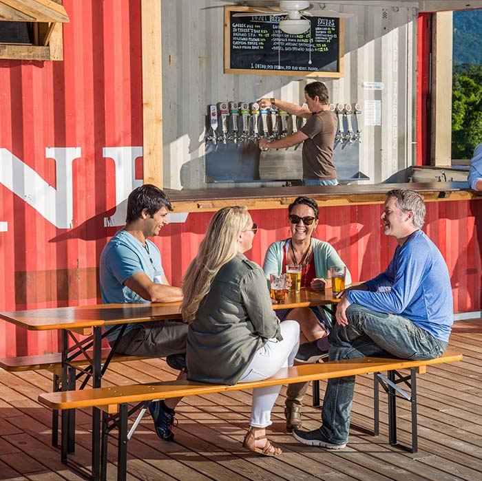 A group drinking beer at a bar.