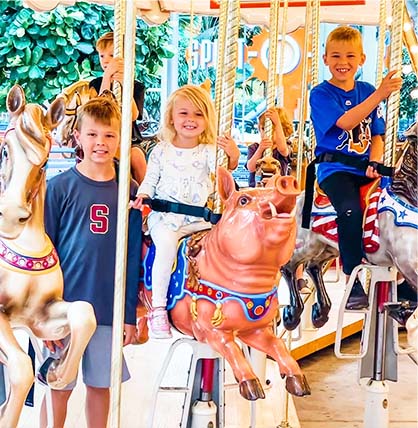 A group of children on a merry-go-round.