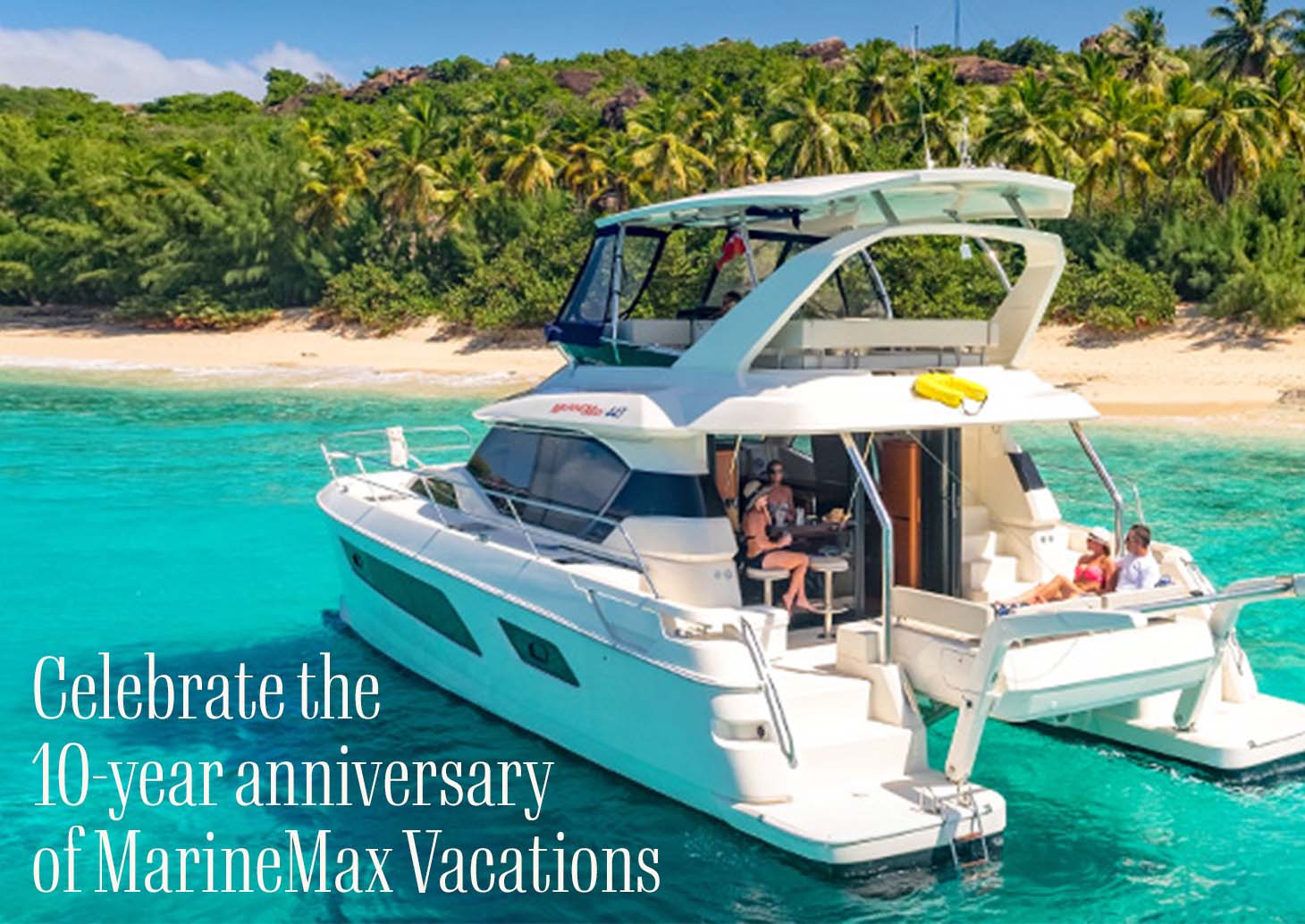 An image of a group of people on a boat in crystal turqoise waters. A headline reads: Celebrate the 10-year anniversary of MarineMax Vacations