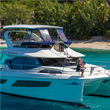 A group of people on a boat in beautiful turqoise waters.