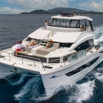 A group of people on a boat in beautiful turqoise waters.