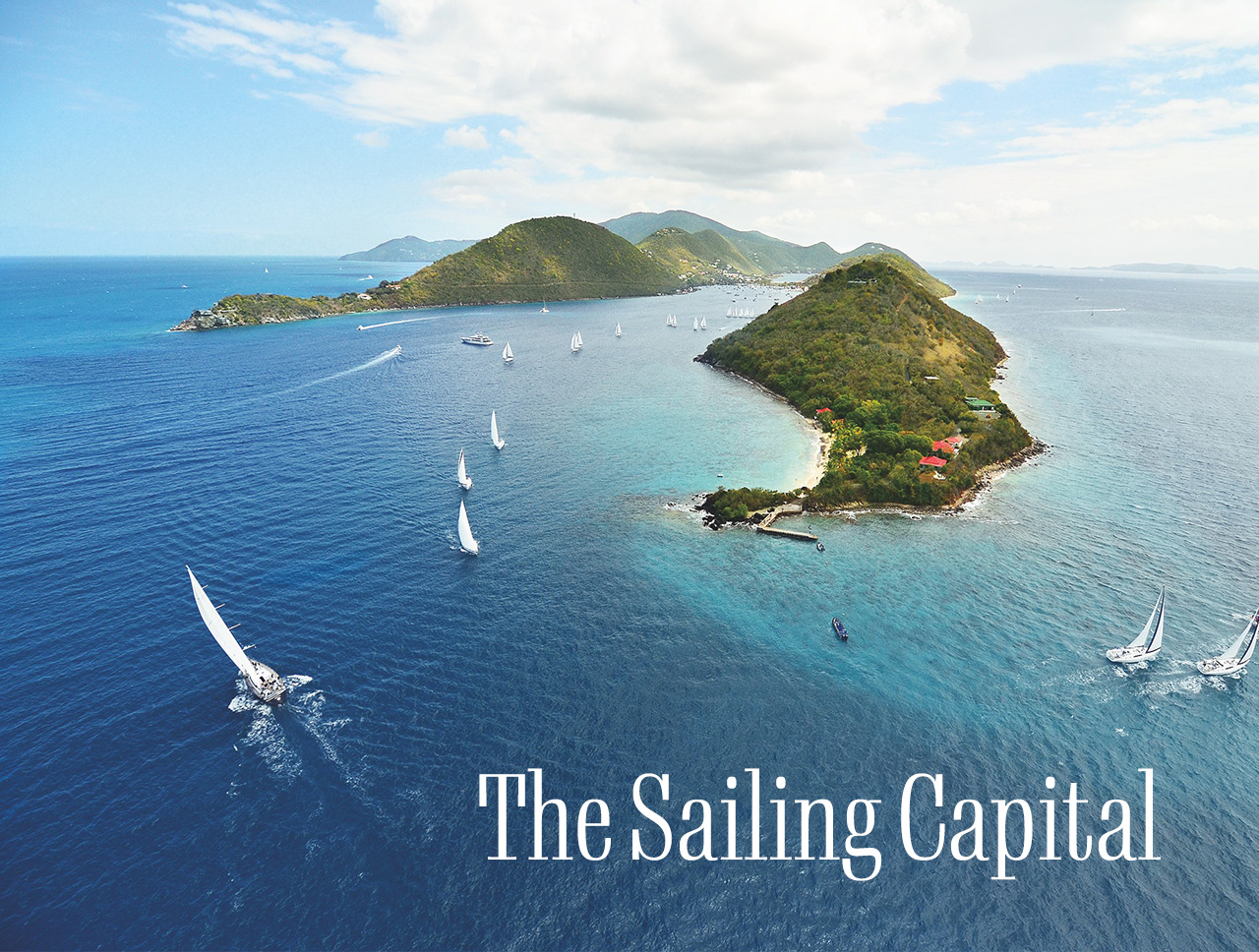 Aerial view of boats sailing around the islands. A headline reads: The Sailing Capital.