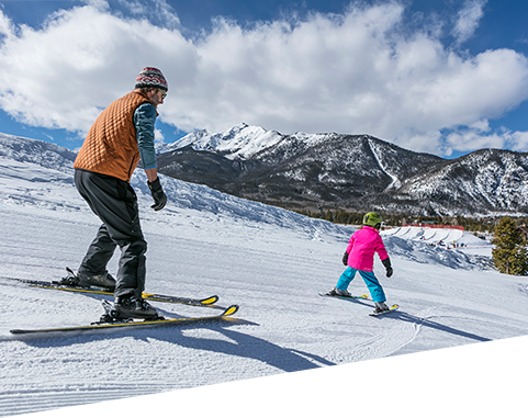 Parent and child skiing