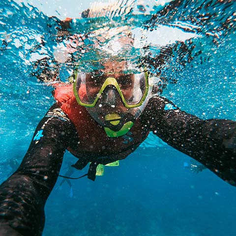 Man taking an underwater selfie while snorkling
