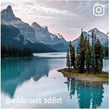 Image of sunrise on the back side of the mountains also reflecting on the lake water. Instagram @wilderness_adidict
