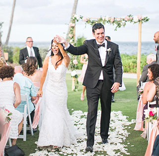 Newly married couple walking down the isle. 