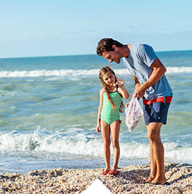 Father and daughter shelling