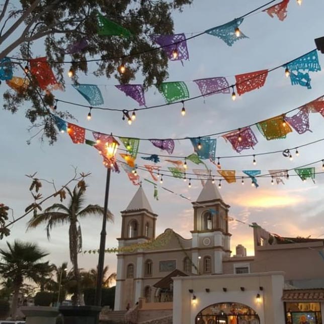 Exterior of luxury hotel decorated with banners and lighting