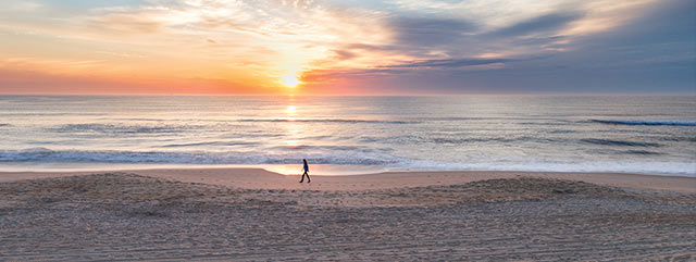 image of a sunset walk on the beach