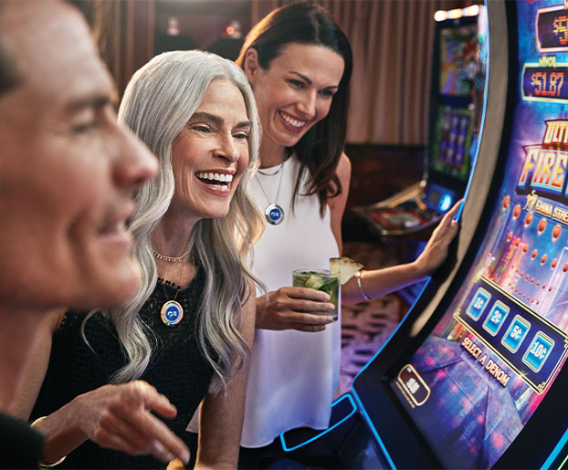 Friends gather at a slot machine