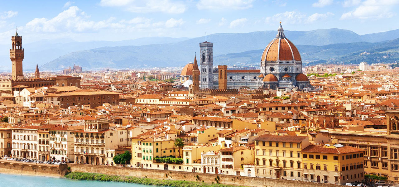 The Duomo surrounded by buildings in Florence, Italy