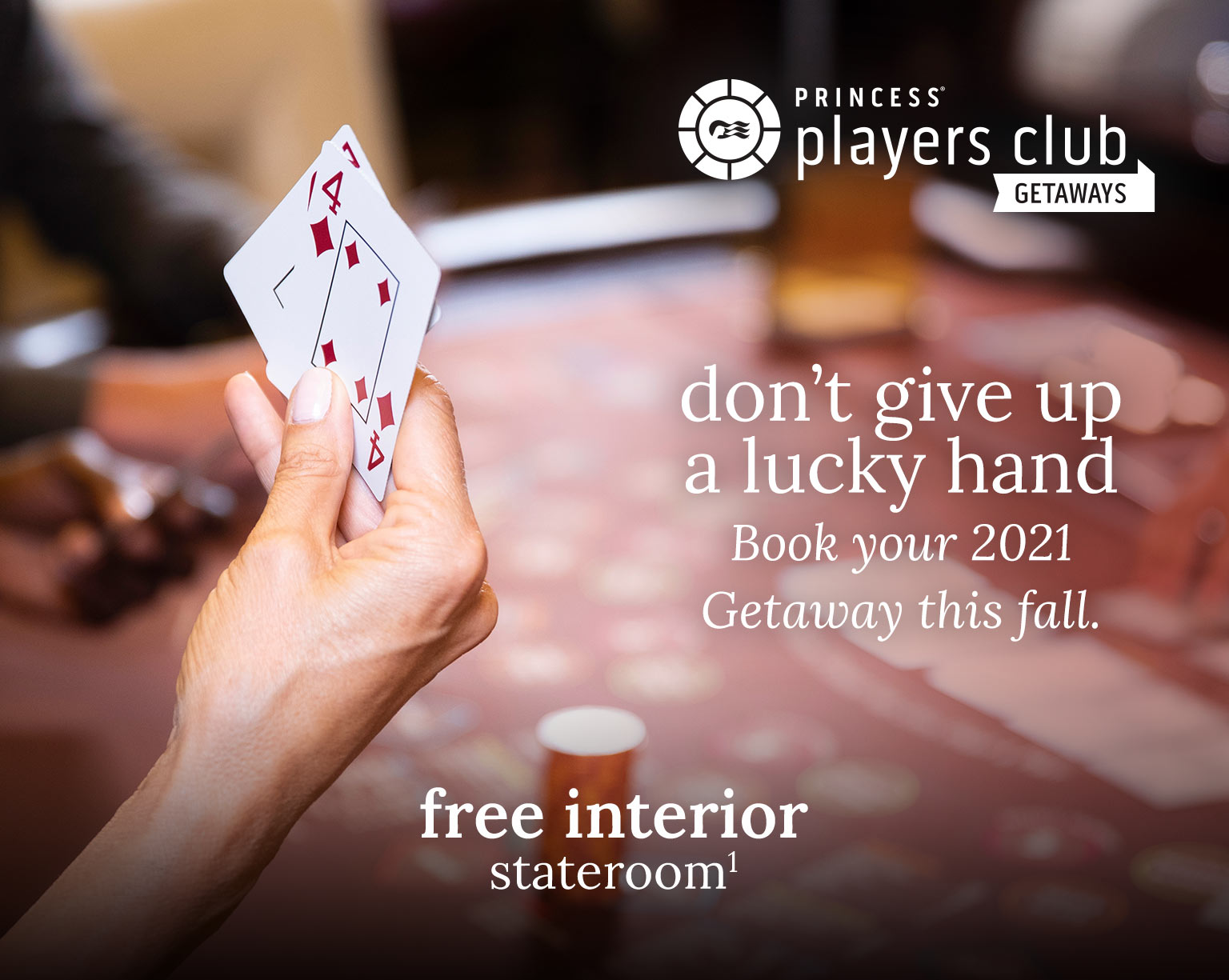 A man and a woman cheer at the slot machines - Princess Players Club Getaways - Don't give up a lucky hand, book your 2021 getaway! - free interior stateroom
