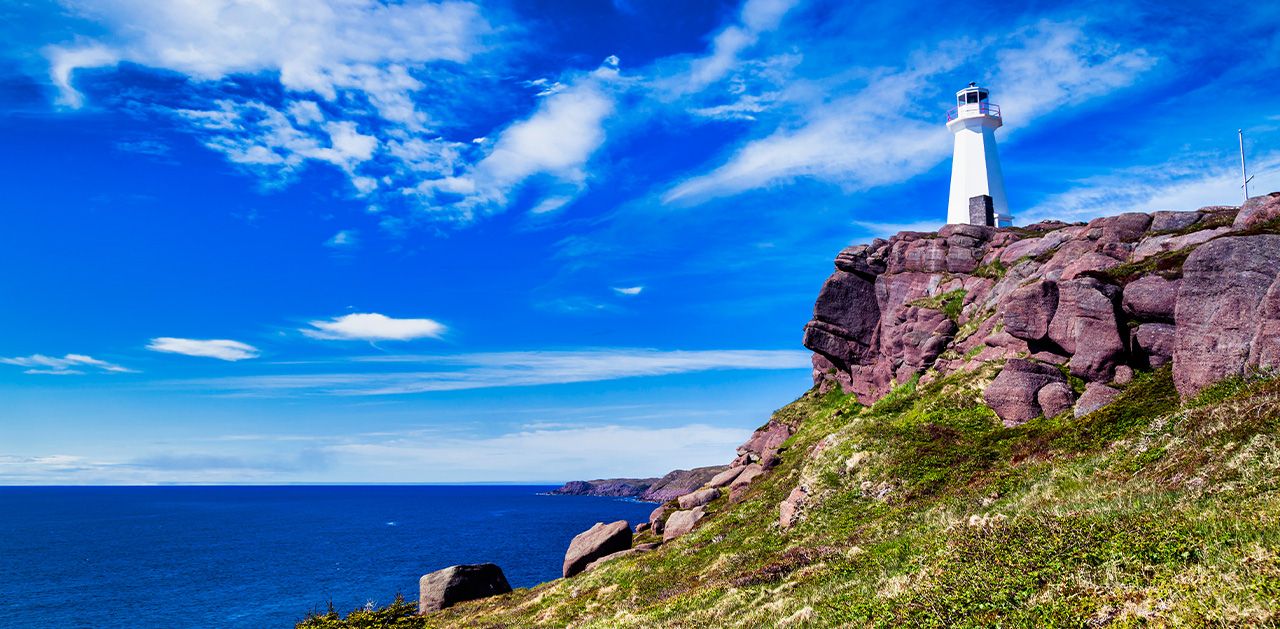 A lighthouse on a rocky cliff