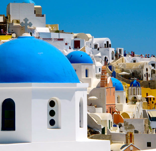 White houses with blue roofs in Santorini