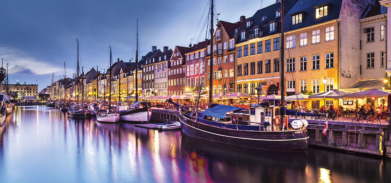 Ships docked along the harbor in Copenhagen, Denmark. Click here to book.