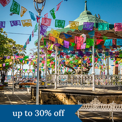 Festive flags decorating a gazebo in Mexico. Click here to book.