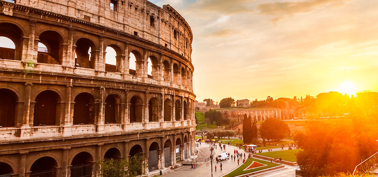 The Roman Colosseum at sunset. Click here to book.