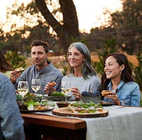 A couple enjoying wine on a patio.