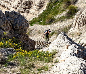 Woman walking up steps in a mountain