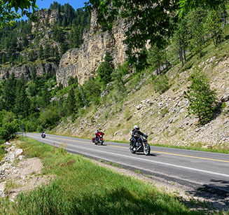 Motorcycle riders on an open stretch of highway