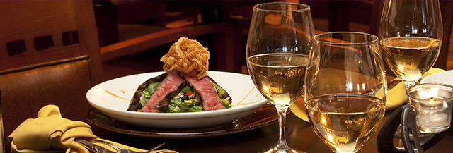 A beautiful steak salad paired with white wine. 