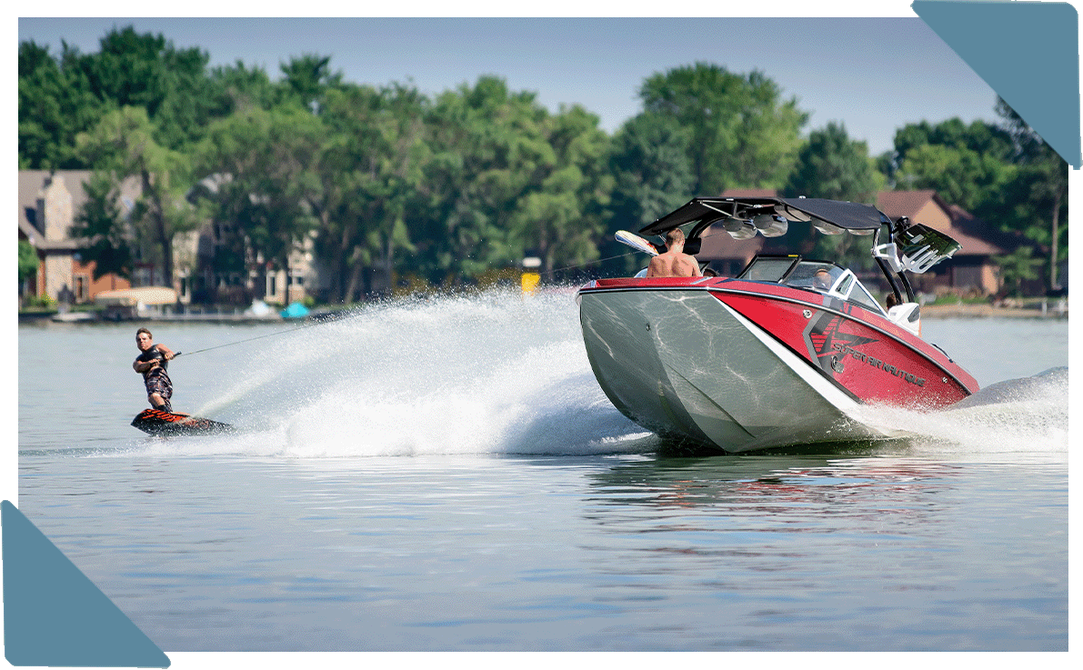 Someone waterskiing behind a boat.