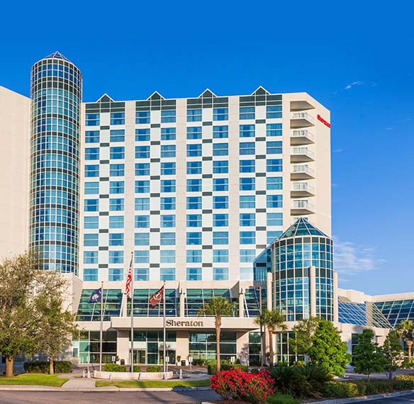 Exterior of resort on a bright, cloudless day.