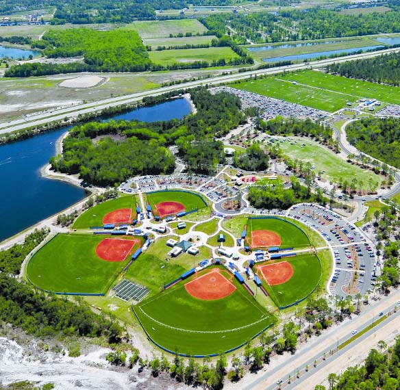 An arial photo of multiple baseball diamonds next to one another.
