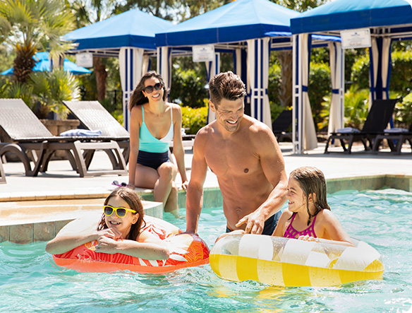 A family playing in the pool.