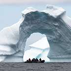 Boat passing under an ice arch